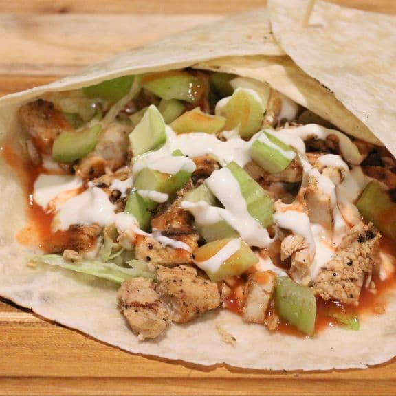 Guilderland Wrap (Buffalo Style) - Grilled chicken breast, romaine lettuce, thinly sliced celery, hot sauce and blue cheese dressing, wrapped in a warm tortilla.