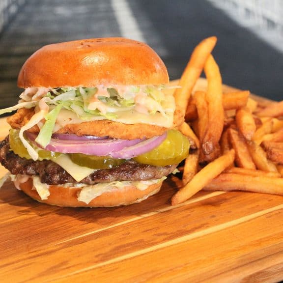 Good Fellas Burger - Breaded chicken patty and fresh natural, hand-crafted ground beef, pickles, onions, double pepper jack cheese, and extra napkin sauce.