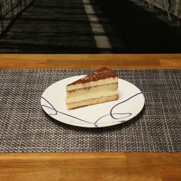 Tiramisu - Classic Italian dessert with layers of coffee-soaked ladyfingers and mascarpone cream.