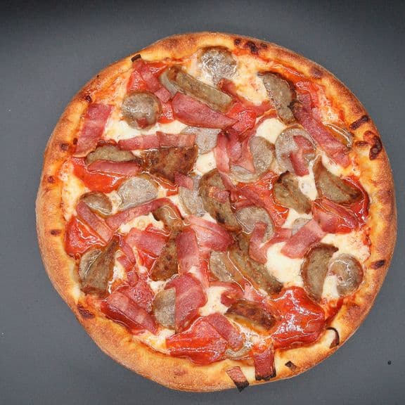 Butcher Pizza - Pizza sauce, mozzarella cheese, pepperoni, sausage, turkey bacon, meatballs