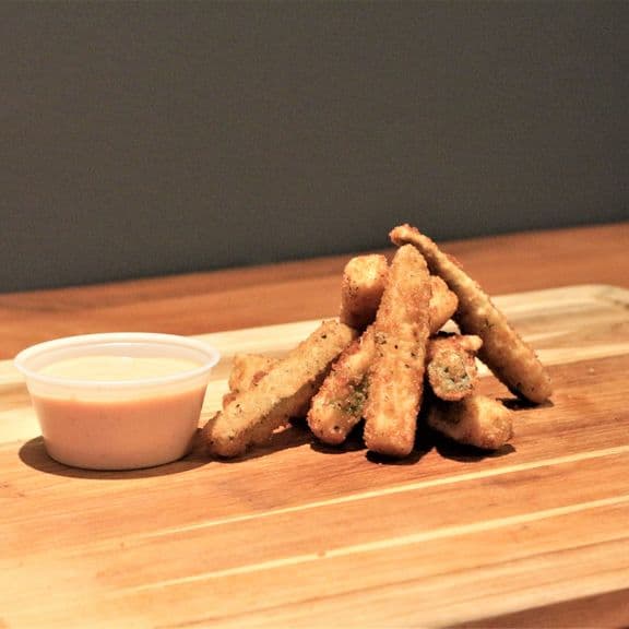 Breaded Zucchini - Eight pieces of fresh zucchini slices coated in seasoned Italian breadcrumbs and fried to a golden crisp. Accompanied by our house-made marinara sauce.